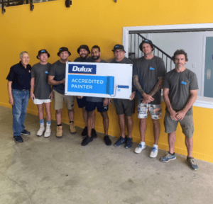 Salvation Army Major Peter Sutcliffe Left, with T2S staff and Dulux accredited painters at completion of Salvation Army community project